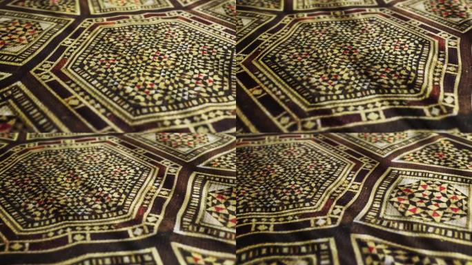 织物布与传统的伊斯兰，亚洲图案宏观特写镜头与pan运动。奥斯曼的设计，复古东方桌布。