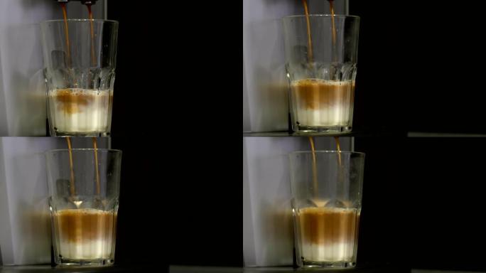 将咖啡机中的咖啡倒入装有牛奶的玻璃杯中。拿铁