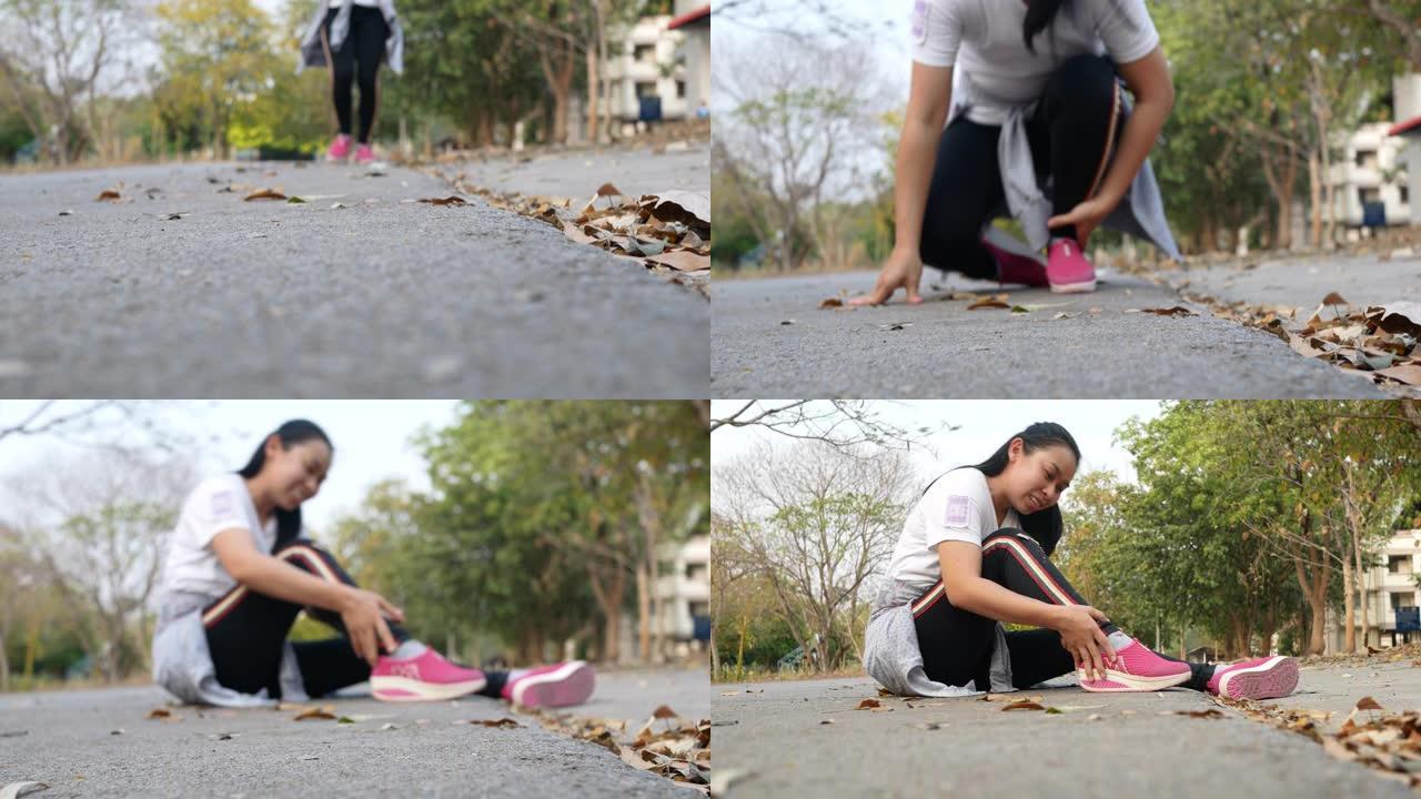 女运动员在公园训练跑步时触摸疼痛的脚踝扭伤。锻炼后脚踝疼痛的女人。