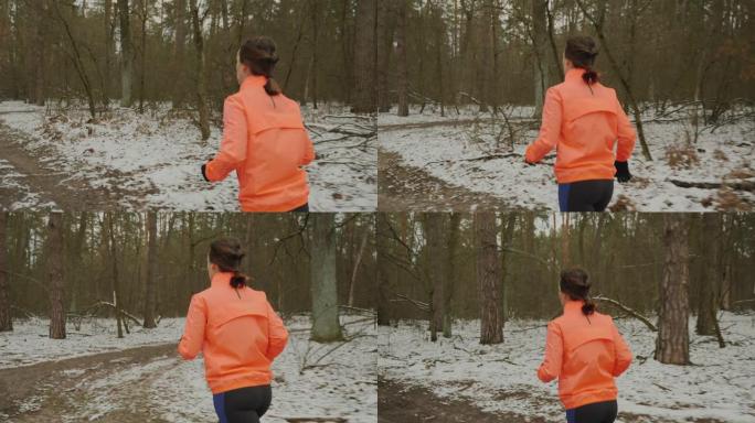 女人在公园里跑步。女性正在休赛期训练。穿着橙色夹克和蓝色紧身衣的女孩在户外慢跑。专业运动员为马拉松做