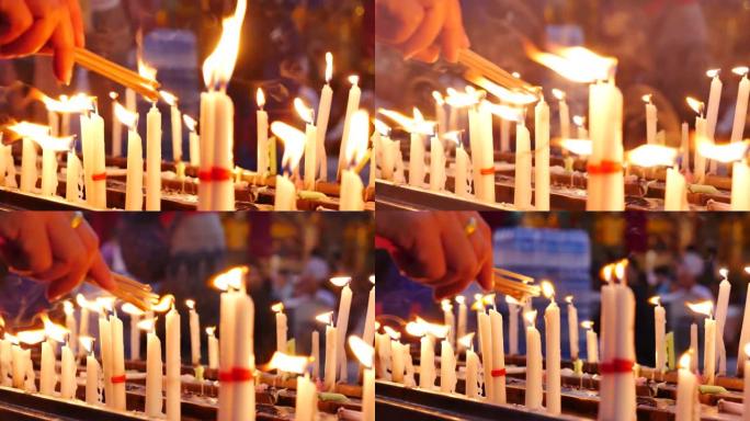 火苗传统蜡烛代替朝拜，在灵修佛寺祈祷。烛火燃烧着温暖的烛光。