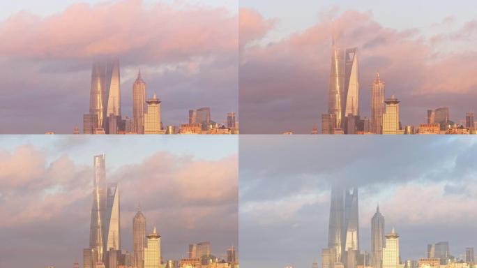 早上上海城市景观的延时镜头，三个最高的地标，美丽的云彩反射阳光，4k视频。