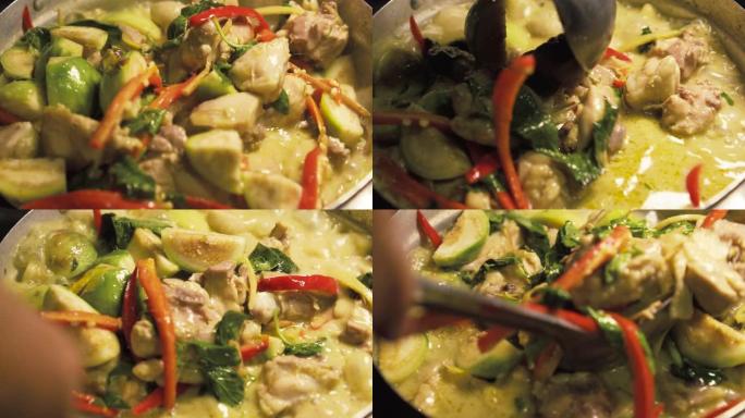 老太太用勺子搅拌咖喱。用鸡肉做绿咖喱。泰国菜。慢动作。