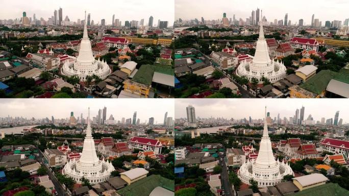 鸟瞰图在泰国曼谷市的寺庙上空移动