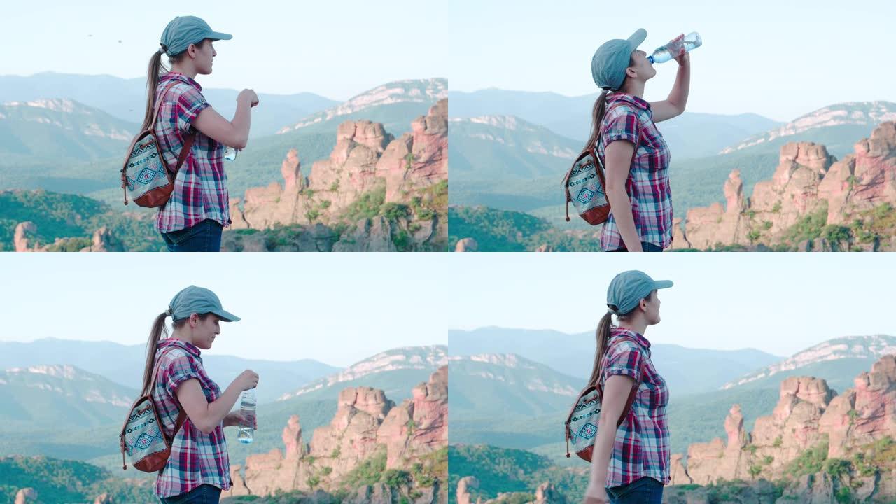 回归自然。单人旅行者在美丽的全景前，从高处俯瞰美丽的红色岩层。一个快乐的年轻女子游客走在大自然中。饮