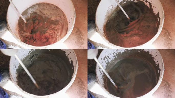 桶内水泥搅拌。混凝土和砂水泥搅拌成砂浆。施工概念