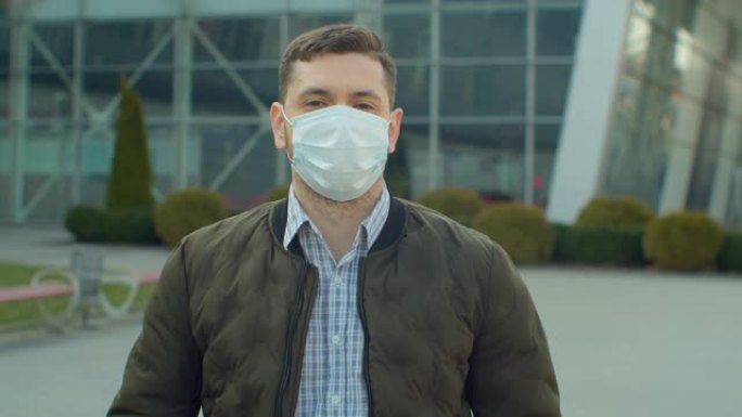 在机场附近戴着防护口罩的男子看。健康与安全生命的概念，N1H1冠状病毒，病毒保护。大流行新型冠状病毒
