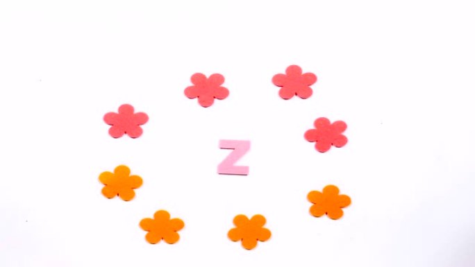 英文字母表的粉红色移动字母Z。白色背景上的舞蹈字母。