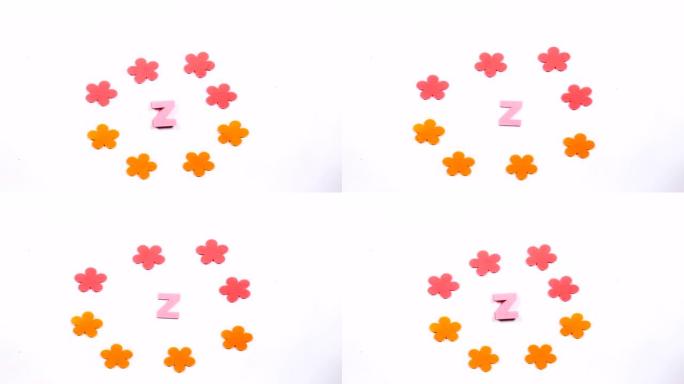 英文字母表的粉红色移动字母Z。白色背景上的舞蹈字母。