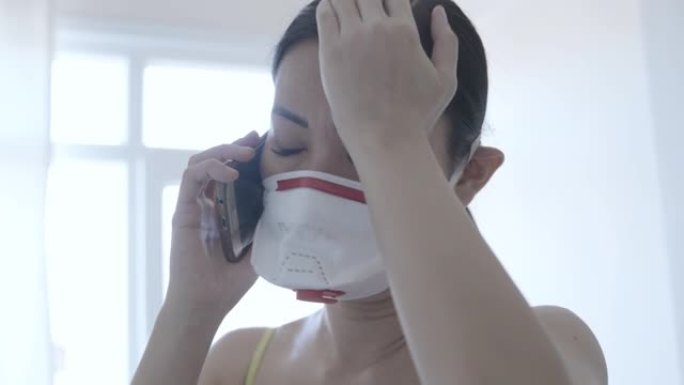 亚洲妇女戴口罩保护冠状病毒，呼叫紧急服务占领者