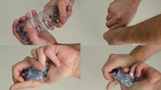 用手压扁一个塑料空瓶。特写。