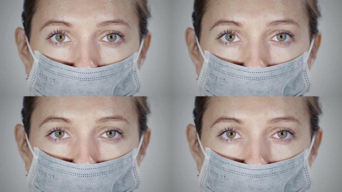 医用防护口罩女性面部的宏观观察。