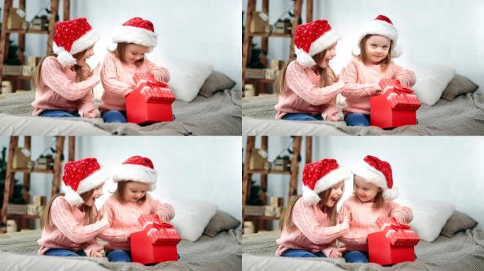 开朗的小妹妹笑着庆祝12月节日开放童话礼物感觉兴奋