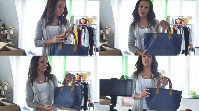 时尚博客作者在她正在拍摄的视频中展示了她的新书包
