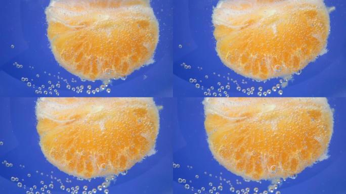 特写橘子果实，背景在水中，水下。背景，纹理。选择性聚焦