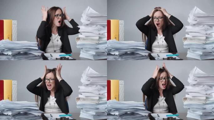不堪重负的女职员在工作中发脾气，成堆未完成的文件夹，文件和文件。财务经理精神崩溃，员工压力大愤怒地尖