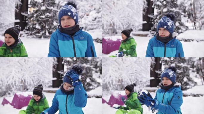 两个男孩打雪仗打雪仗冬季运动童趣