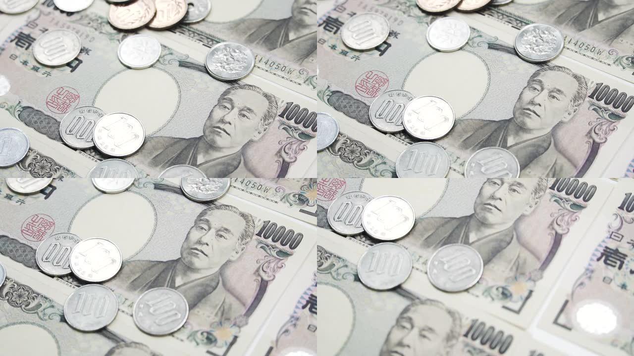 倾斜向下射击硬币和钞票日本货币日元货币。