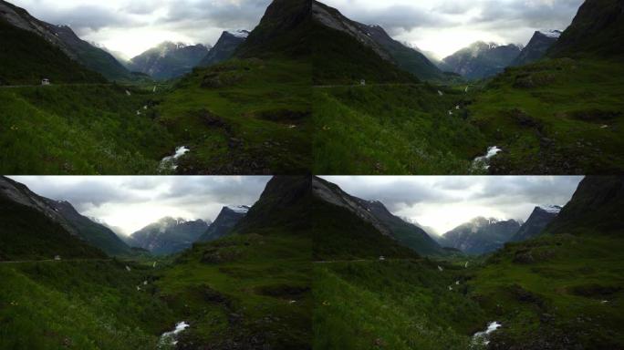 房车在盖朗格的山路上行驶。著名的风景大道、挪威地标和热门旅游目的地。挪威夏季，4k。