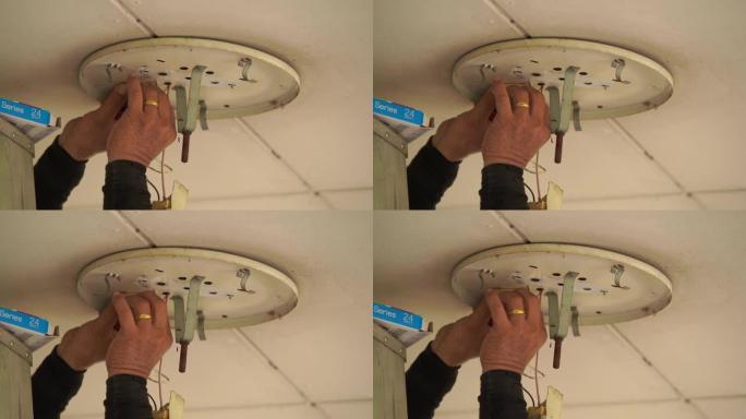 专业电工扭转灯泡安装灯