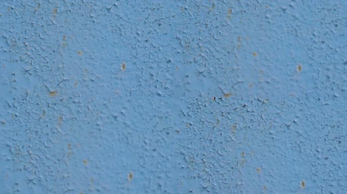 金属蓝色背景墙壁纹理，带有划痕和裂缝。平滑的相机移动和放置文本。运动4k视频，4096x2160镜头
