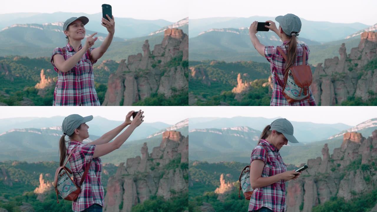回归自然。视频记录。自拍时间。单人旅行者在美丽的全景前，从高处俯瞰美丽的红色岩层。一个快乐的年轻女子