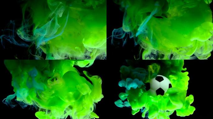 足球冲破了绿色的烟雾。概念保护广告足球比赛。