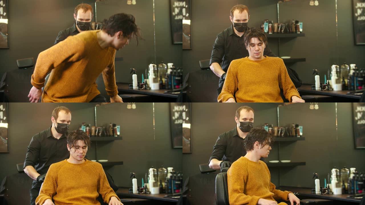 一个湿头发的年轻人坐在理发店的椅子上