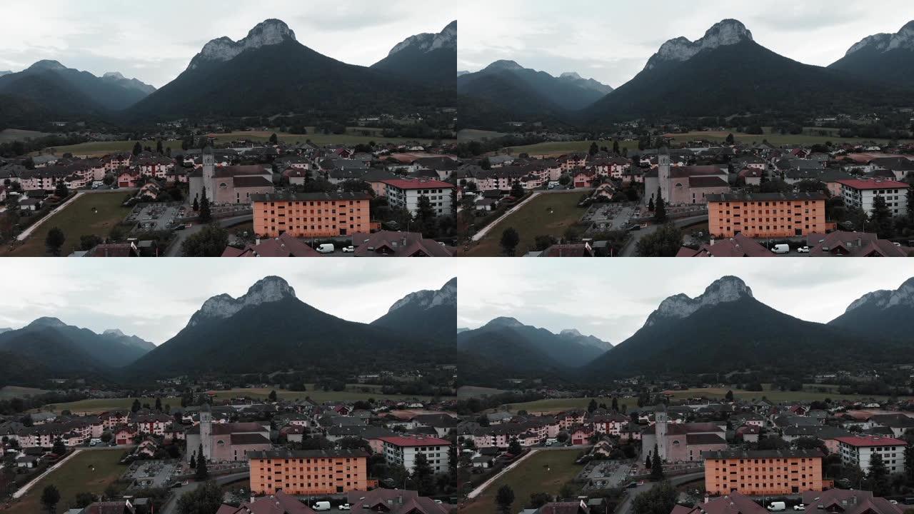 以山脉为背景的杜萨德公社。无人驾驶飞机拍摄了山谷中小村庄的阿尔卑斯山景色