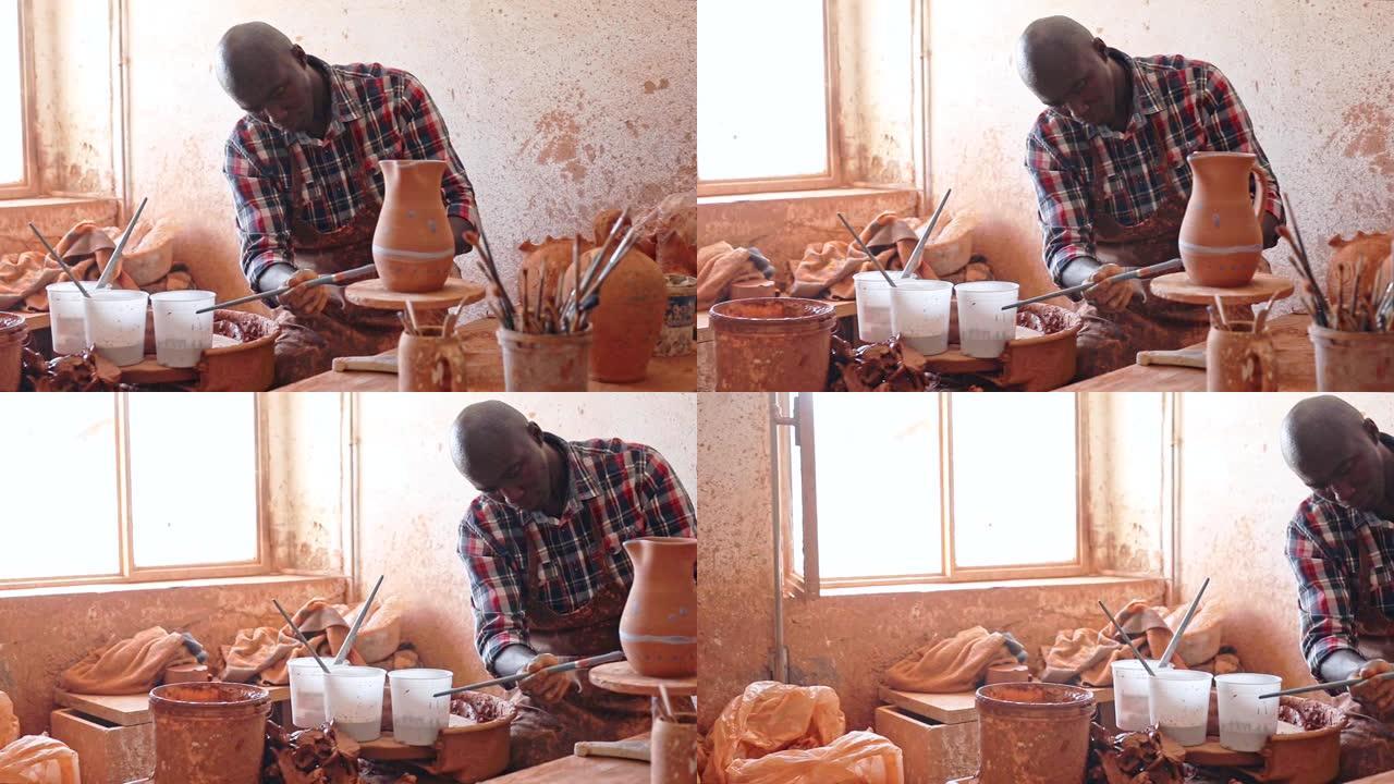 专注于在陶器车间工作的非洲人