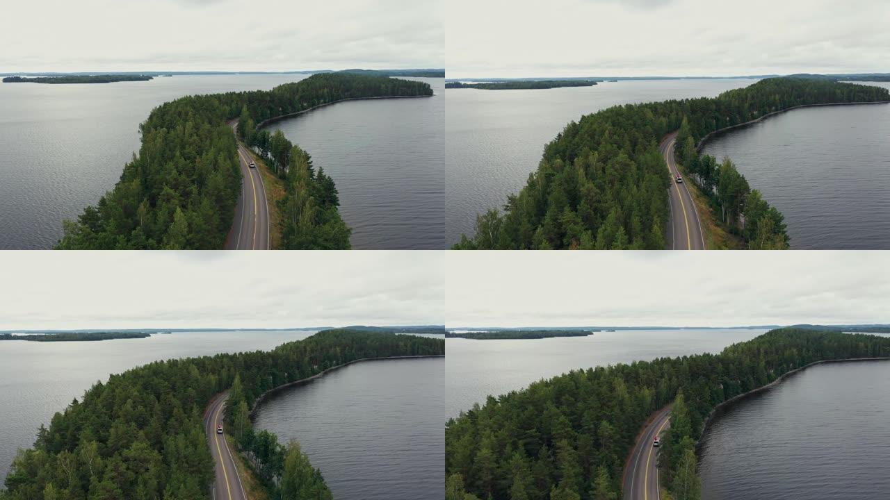 坎珀面包车的风景鸟瞰图，在芬兰莱克兰的湖边，屋顶上有独木舟