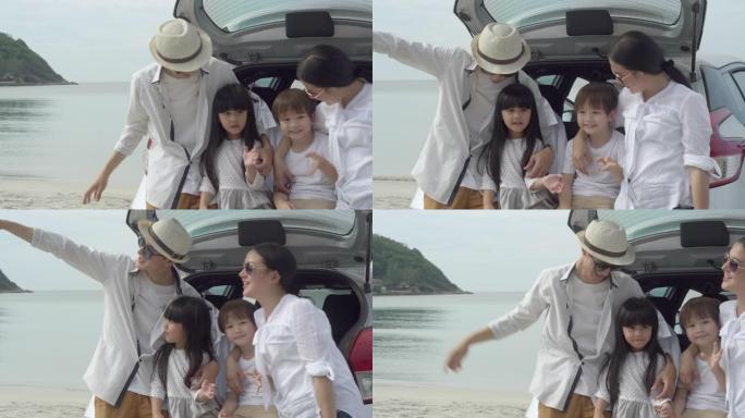 快乐的亚洲家庭坐在车里去海滩旅行，在度假中一起放松身心，享受快乐的父母在夏天以热带度假的概念在海上休