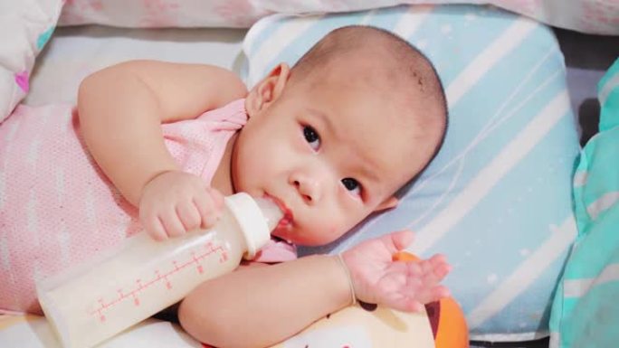 婴儿喝牛奶。哺乳期小宝宝新生儿家庭生活