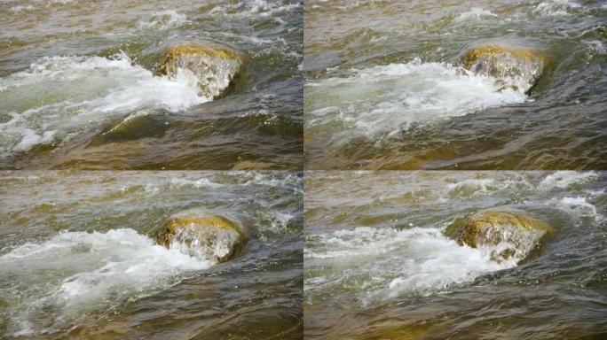 在小石头上流过春河的水，慢动作视频