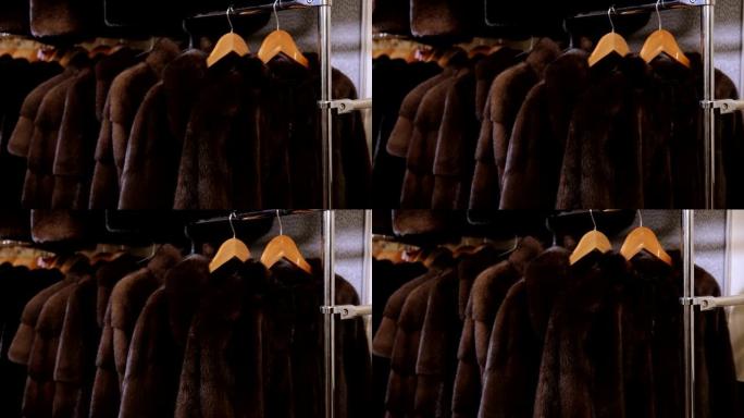在皮草商店的trempel上，美丽的不同颜色的皮草大衣。慢速mo