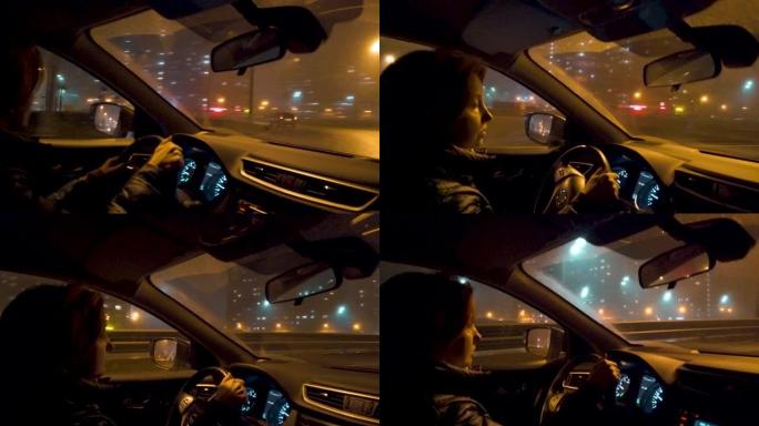 在夜城，一名妇女坐在汽车的方向盘后面