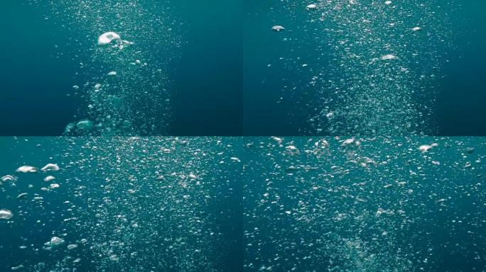 海洋中的水下气泡。气泡漂浮在热带蓝色的海面上。