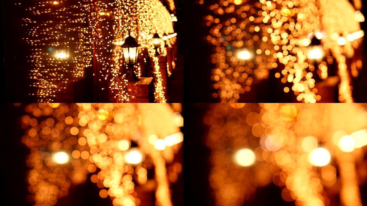 圣诞节晚上街灯上节日模糊的金光