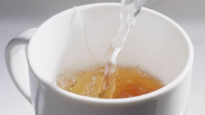 Ping hot water into a cup of tea