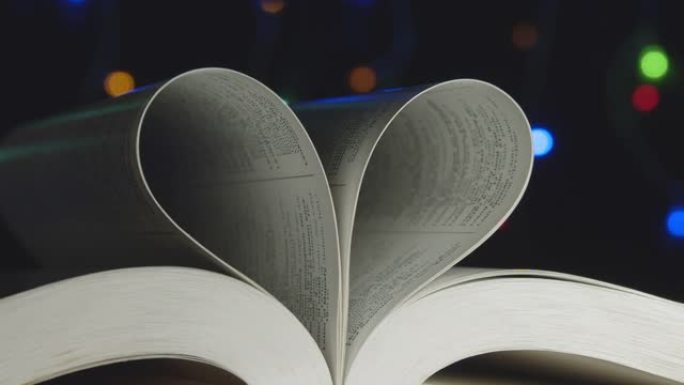 爱的书，书页滚入心 -- 情人节概念