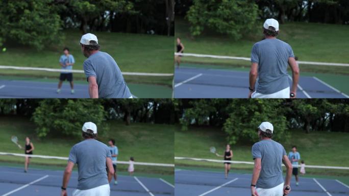 打网球比赛的老人的后背