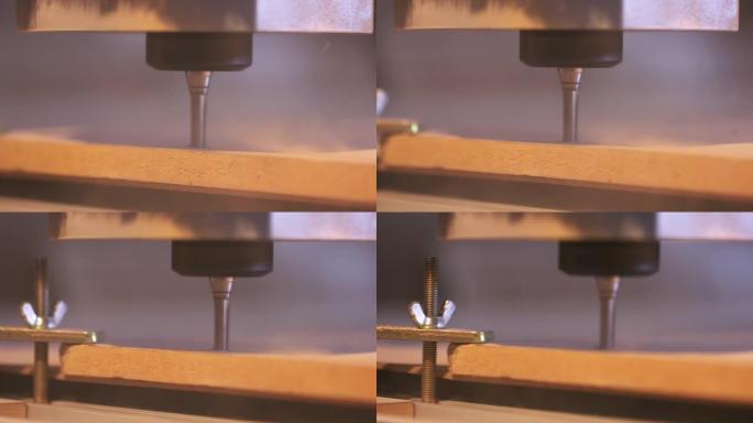 雕刻木材时，由计算机控制的木材切割机的特写镜头。行动。数控铣床雕刻木制零件毛坯