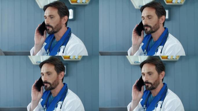 医务室男医生在慢动作中打电话的肖像。