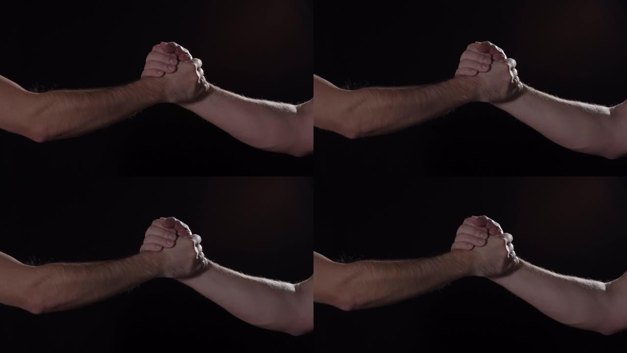 高加索男性在黑色背景上表达运动握手，近距离孤立，4K