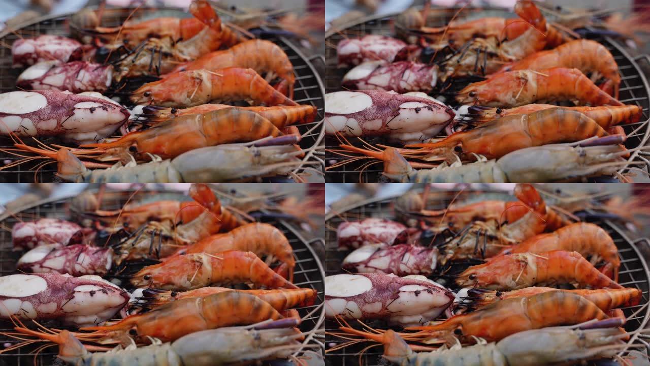 泰国床单海鲜餐厅的木炭烤虾和鱿鱼。