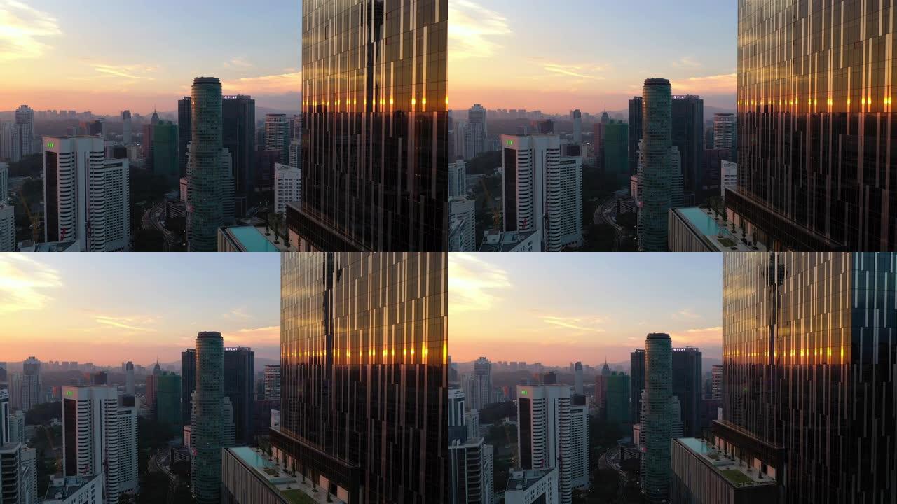 日落时间吉隆坡市中心摩天大楼反射航空全景4k马来西亚