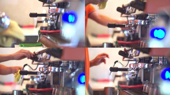 咖啡师将咖啡从机器滴入杯子。