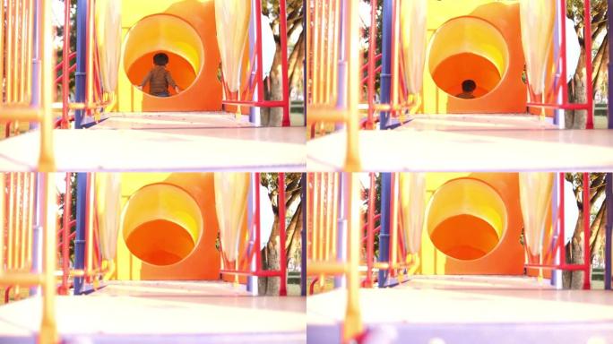 SLO MO，亚洲男婴在操场上滑行