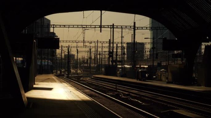 日落时间苏黎世城市火车站站台太阳灯铁路全景4k瑞士
