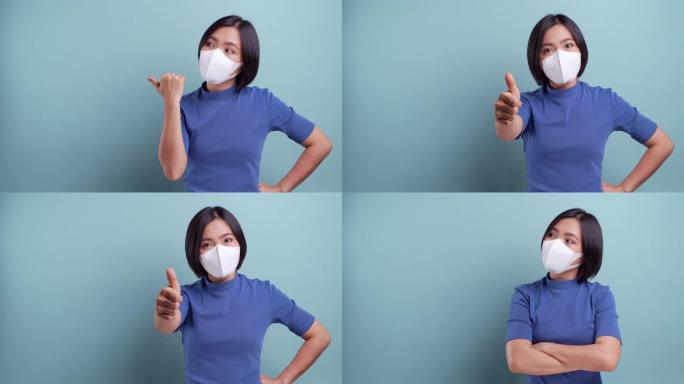 戴着卫生面具的亚洲妇女的肖像被隔离在蓝色背景上